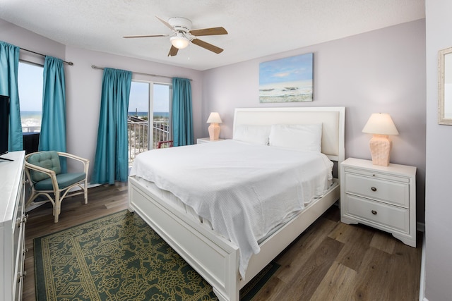 376 Santa Rosa Blvd Unit 101, Fort Walton Beach, FL 32548 - bedroom with dark wood-style flooring, access to exterior, and a ceiling fan