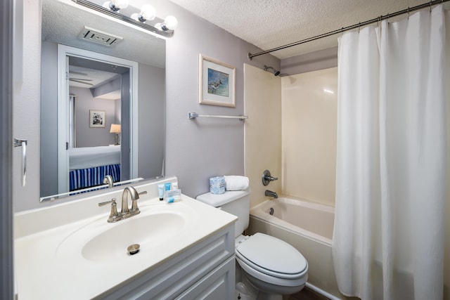 376 Santa Rosa Blvd Unit 101, Fort Walton Beach, FL 32548 - full bath with a textured ceiling, shower / bathtub combination with curtain, toilet, and vanity