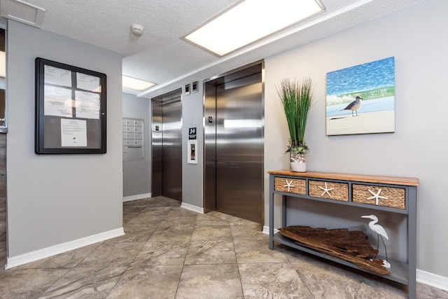 376 Santa Rosa Blvd Unit 101, Fort Walton Beach, FL 32548 - corridor with elevator, baseboards, and a textured ceiling