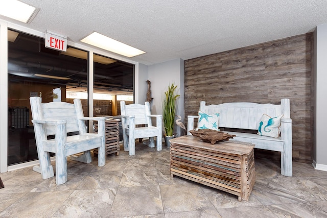 376 Santa Rosa Blvd Unit 101, Fort Walton Beach, FL 32548 - bedroom with wood walls and a textured ceiling