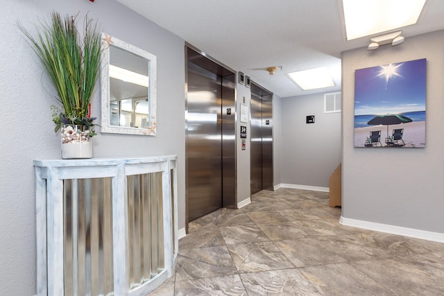 376 Santa Rosa Blvd Unit 101, Fort Walton Beach, FL 32548 - corridor featuring elevator and baseboards