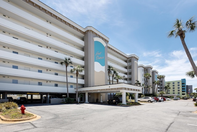 376 Santa Rosa Blvd Unit 101, Fort Walton Beach, FL 32548 - view of property featuring covered and uncovered parking
