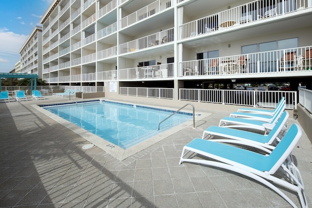 376 Santa Rosa Blvd Unit 101, Fort Walton Beach, FL 32548 - community pool featuring a patio area