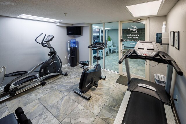 376 Santa Rosa Blvd Unit 101, Fort Walton Beach, FL 32548 - gym with baseboards and a textured ceiling