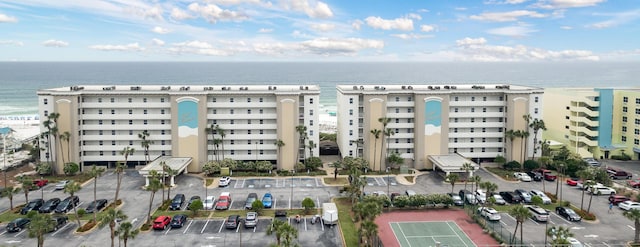 376 Santa Rosa Blvd Unit 101, Fort Walton Beach, FL 32548 - view of building exterior featuring a water view and uncovered parking