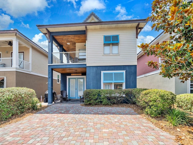 216 Tahitian Way, Destin, FL 32541 - view of front facade featuring a balcony and stucco siding