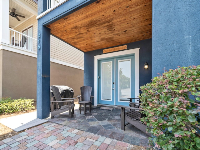 216 Tahitian Way, Destin, FL 32541 - view of exterior entry featuring stucco siding, a patio, and a ceiling fan