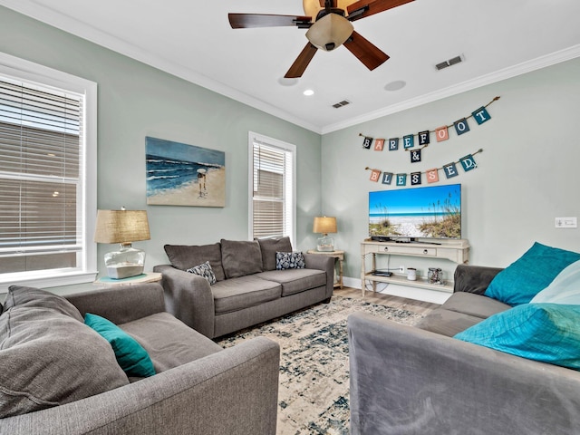 216 Tahitian Way, Destin, FL 32541 - living room with crown molding, a ceiling fan, wood finished floors, recessed lighting, and baseboards