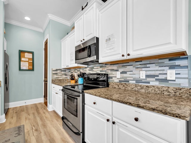 216 Tahitian Way, Destin, FL 32541 - kitchen with stainless steel appliances, crown molding, white cabinetry, backsplash, and baseboards