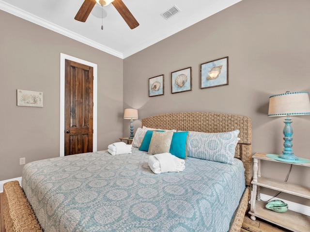 216 Tahitian Way, Destin, FL 32541 - bedroom featuring crown molding, wood finished floors, baseboards, and a ceiling fan