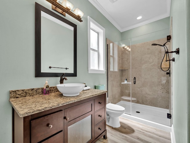 216 Tahitian Way, Destin, FL 32541 - full bath with toilet, vanity, a stall shower, ornamental molding, and wood finished floors