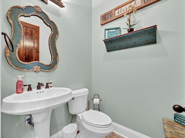 216 Tahitian Way, Destin, FL 32541 - bathroom with baseboards, toilet, and wood finished floors