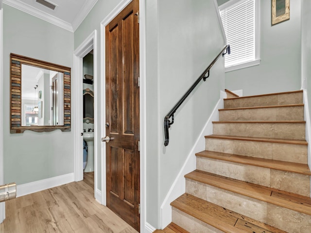 216 Tahitian Way, Destin, FL 32541 - staircase featuring ornamental molding, wood finished floors, and baseboards