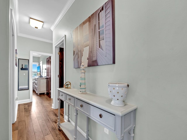216 Tahitian Way, Destin, FL 32541 - corridor featuring ornamental molding, light wood-style floors, and baseboards