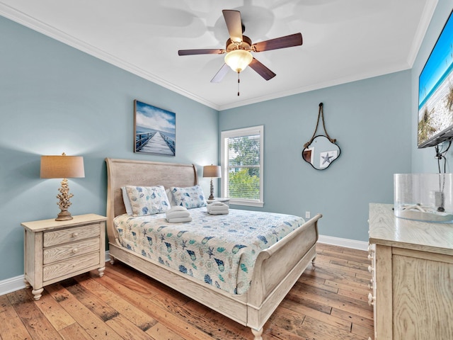 216 Tahitian Way, Destin, FL 32541 - bedroom with baseboards, multiple windows, wood-type flooring, and crown molding
