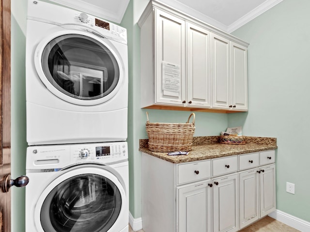 216 Tahitian Way, Destin, FL 32541 - laundry area with stacked washer / dryer, cabinet space, ornamental molding, and baseboards