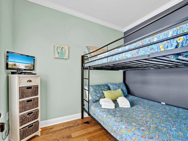 216 Tahitian Way, Destin, FL 32541 - bedroom with hardwood / wood-style flooring, baseboards, and ornamental molding