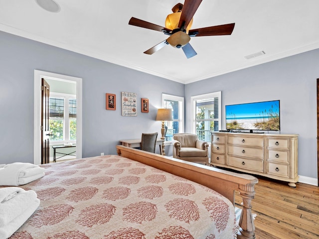 216 Tahitian Way, Destin, FL 32541 - bedroom featuring wood-type flooring, ornamental molding, a ceiling fan, and baseboards