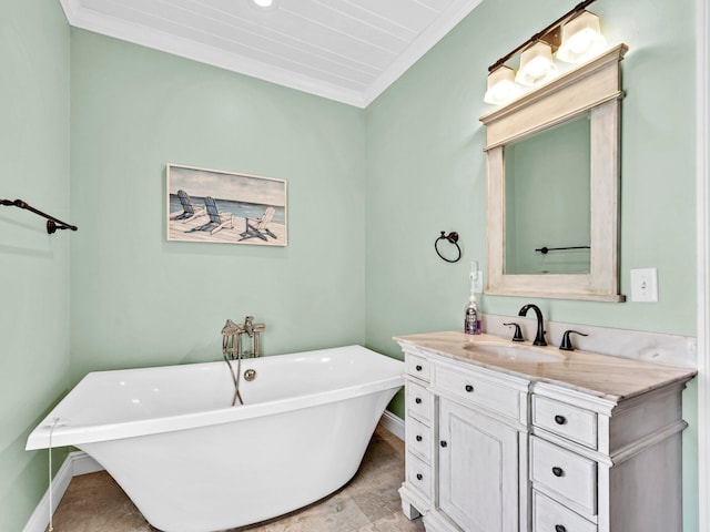 216 Tahitian Way, Destin, FL 32541 - bathroom with a freestanding bath, crown molding, baseboards, and vanity