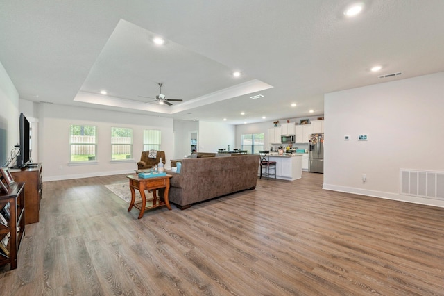 125 Hobson Ave, Crestview, FL 32539 - living area with light wood-style flooring, a ceiling fan, recessed lighting, and healthy amount of natural light