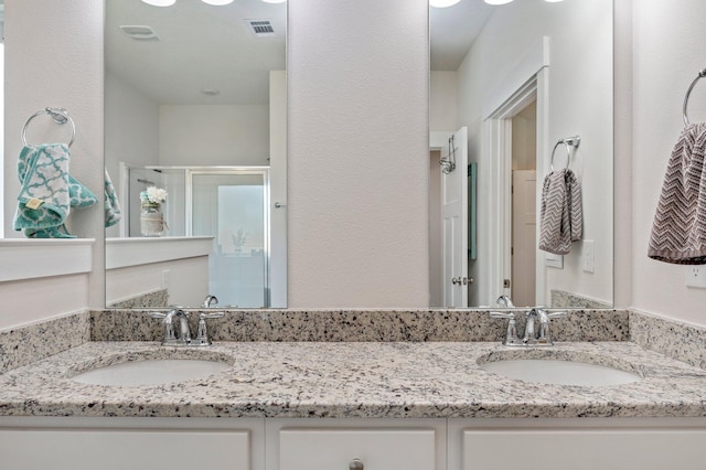 125 Hobson Ave, Crestview, FL 32539 - full bathroom featuring double vanity and a stall shower