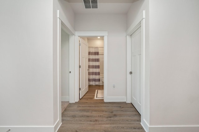 125 Hobson Ave, Crestview, FL 32539 - hallway featuring wood finished floors and baseboards