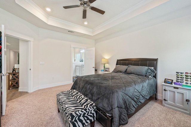 125 Hobson Ave, Crestview, FL 32539 - carpeted bedroom with ornamental molding, baseboards, a raised ceiling, recessed lighting, and connected bathroom