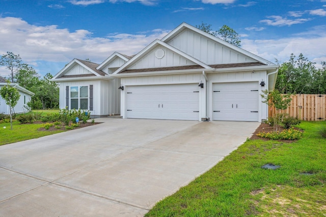 125 Hobson Ave, Crestview, FL 32539 - view of front of home featuring board and batten siding, driveway, and an attached garage