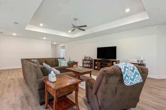 125 Hobson Ave, Crestview, FL 32539 - living area featuring a raised ceiling, light wood-style flooring, a ceiling fan, baseboards, and recessed lighting