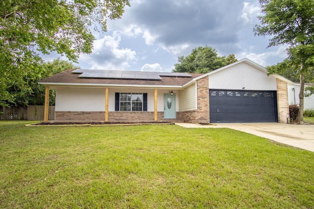 175 Villacrest Dr, Crestview, FL 32536 - ranch-style home featuring brick siding, a garage, solar panels, and concrete driveway