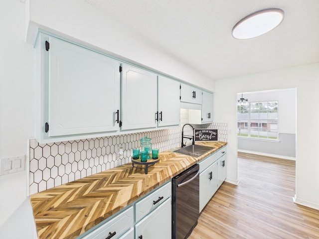 175 Villacrest Dr, Crestview, FL 32536 - kitchen with stainless steel dishwasher, a sink, tasteful backsplash, and white cabinets