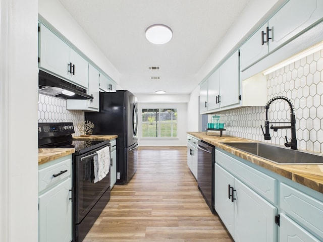175 Villacrest Dr, Crestview, FL 32536 - kitchen with black / electric stove, under cabinet range hood, stainless steel dishwasher, a sink, and decorative backsplash
