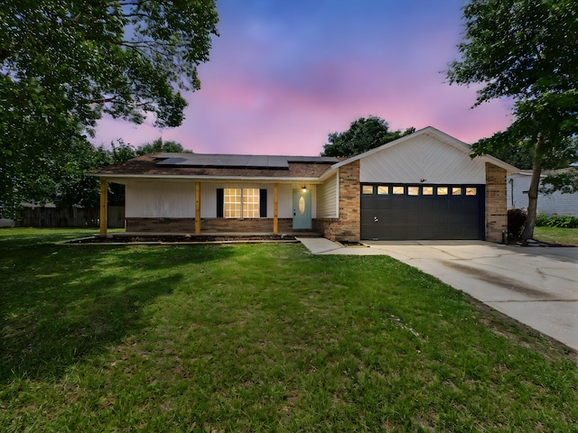 175 Villacrest Dr, Crestview, FL 32536 - single story home featuring an attached garage, concrete driveway, solar panels, and brick siding