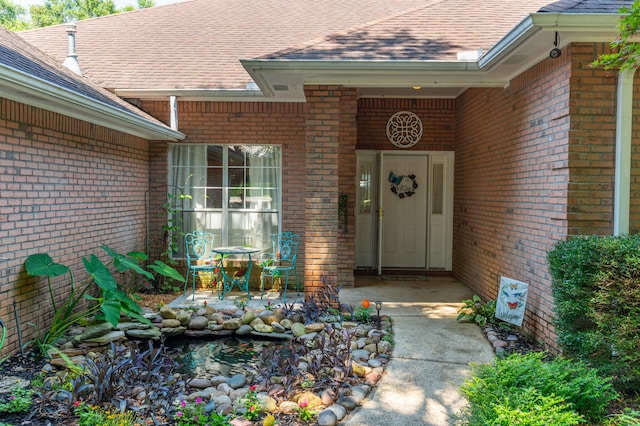4680 Lovegrass Ln, Crestview, FL 32539 - view of exterior entry with brick siding and roof with shingles