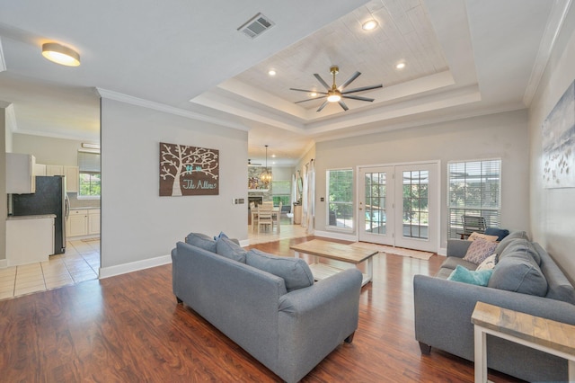 4680 Lovegrass Ln, Crestview, FL 32539 - living area with a raised ceiling, wood finished floors, ceiling fan, recessed lighting, and crown molding