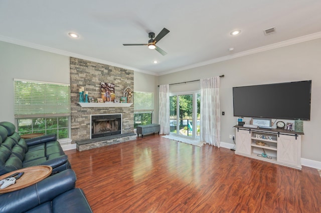 4680 Lovegrass Ln, Crestview, FL 32539 - living room with a ceiling fan, wood finished floors, a fireplace, crown molding, and recessed lighting