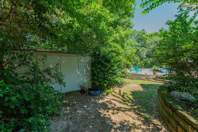 4680 Lovegrass Ln, Crestview, FL 32539 - view of yard with a storage unit and a swimming pool