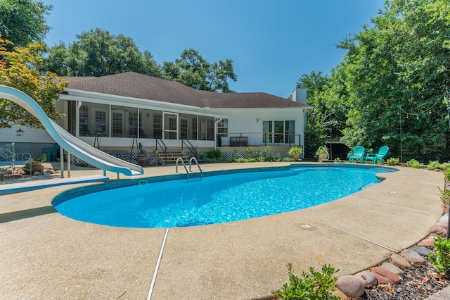 4680 Lovegrass Ln, Crestview, FL 32539 - swimming pool with a water slide and a patio