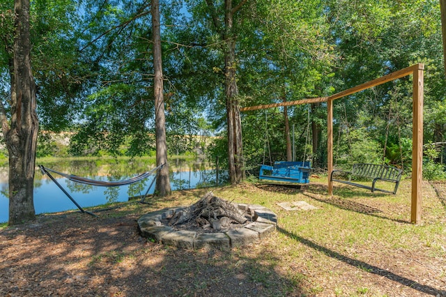 4680 Lovegrass Ln, Crestview, FL 32539 - view of grassy yard with a water view and a fire pit