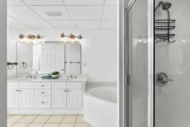 14701 Front Beach Rd Unit 1331, Panama City Beach, FL 32413 - full bathroom with a shower stall, a bath, double vanity, a drop ceiling, and tile patterned floors