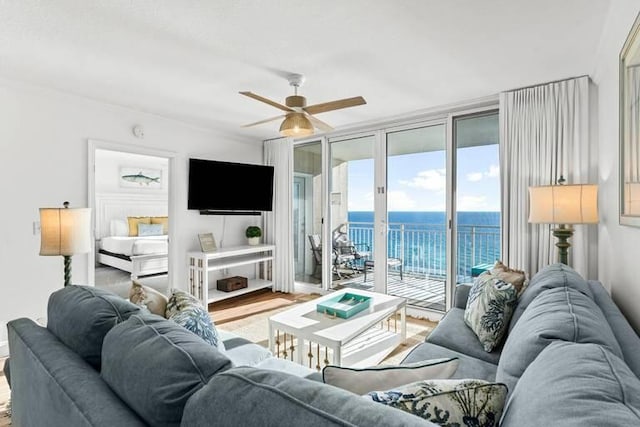 14701 Front Beach Rd Unit 1331, Panama City Beach, FL 32413 - living area featuring wood finished floors, a ceiling fan, and baseboards