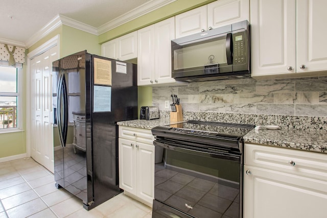 8499 Gulf Blvd Unit 303, Navarre, FL 32566 - kitchen with black appliances, crown molding, light stone counters, white cabinets, and backsplash