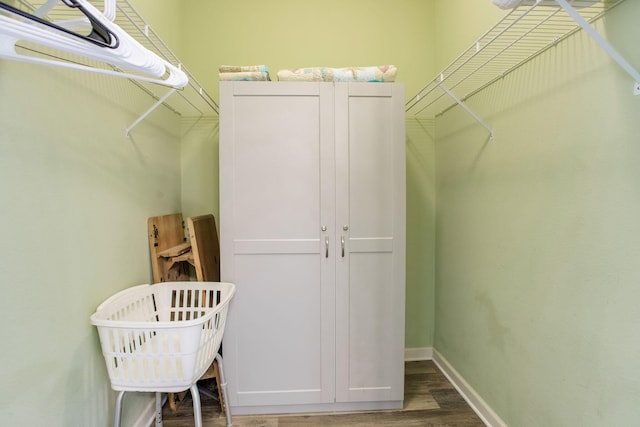 8499 Gulf Blvd Unit 303, Navarre, FL 32566 - walk in closet with wood finished floors