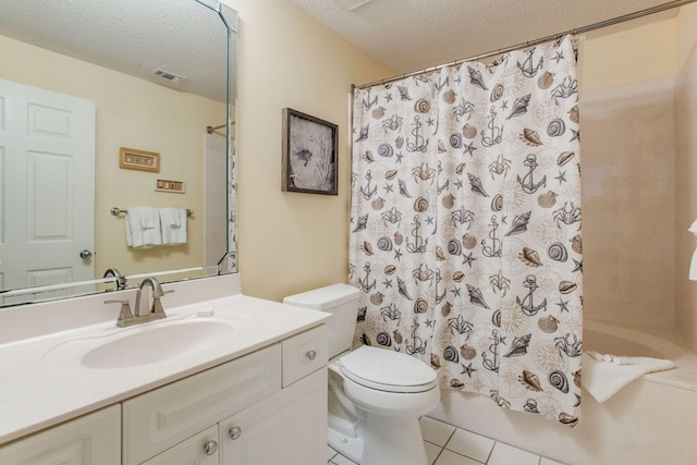 8499 Gulf Blvd Unit 303, Navarre, FL 32566 - bathroom featuring a textured ceiling, tile patterned floors, vanity, and shower / tub combo