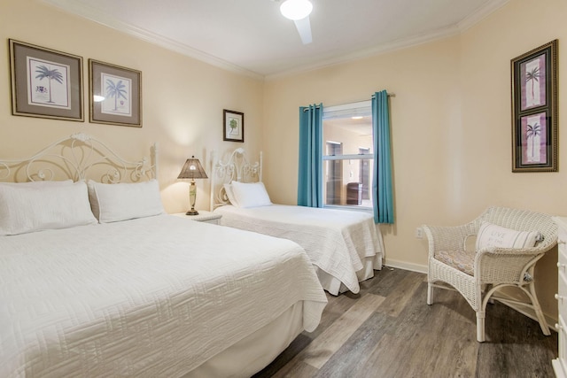 8499 Gulf Blvd Unit 303, Navarre, FL 32566 - bedroom with wood finished floors, ornamental molding, and ceiling fan
