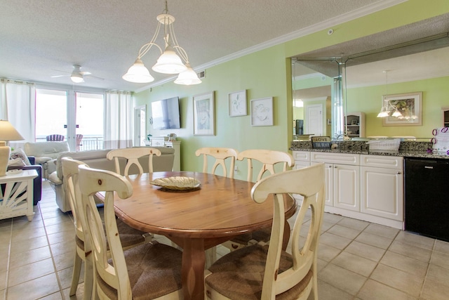 8499 Gulf Blvd Unit 303, Navarre, FL 32566 - dining room featuring ornamental molding, light tile patterned floors, a ceiling fan, and a textured ceiling