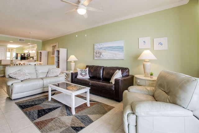 8499 Gulf Blvd Unit 303, Navarre, FL 32566 - living room with crown molding, tile patterned flooring, ceiling fan, and a textured ceiling