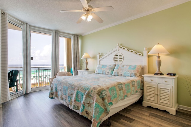 8499 Gulf Blvd Unit 303, Navarre, FL 32566 - bedroom featuring access to exterior, wood finished floors, multiple windows, crown molding, and a textured ceiling