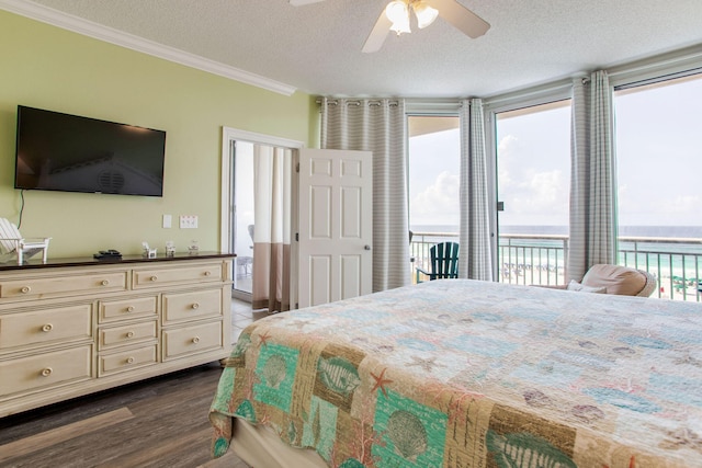 8499 Gulf Blvd Unit 303, Navarre, FL 32566 - bedroom featuring access to outside, crown molding, dark wood-style flooring, a textured ceiling, and a ceiling fan