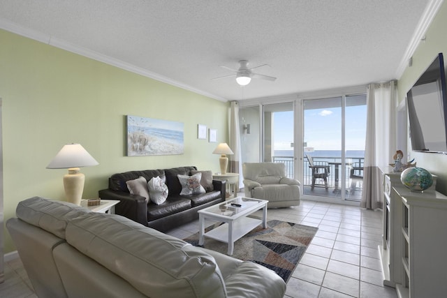 8499 Gulf Blvd Unit 303, Navarre, FL 32566 - living room with ceiling fan, ornamental molding, a textured ceiling, and light tile patterned floors